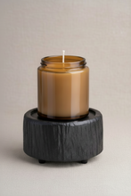 Load image into Gallery viewer, Charred Timber 2-in-1 wax warmer warming a 9oz amber glass candle on textured stone surface