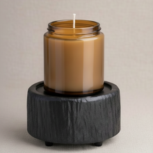 Load image into Gallery viewer, Charred Timber 2-in-1 wax warmer warming a 9oz amber glass candle on textured stone surface