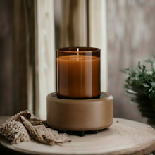 Load image into Gallery viewer, 2-in-1 wax warmer in pewter walnut finish warming an amber glass jar candle on neutral wood surface
