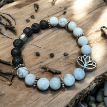 Load image into Gallery viewer, Howlite essential oil stretch bracelet with lotus charm