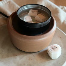 Load image into Gallery viewer, Apothecary Dish with melted Studio Wax Melt cubes on wood wax warmer in calm botanical home fragrance setting