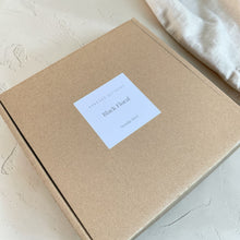 Load image into Gallery viewer, Black Floral smudge bowl packaged in kraft gift box with Vintage Alchemy label on neutral plaster surface with linen cloth