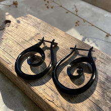 Load image into Gallery viewer, black spiral wood earrings with stick post tribal boho style artisan wooden jewelry on rustic wood board