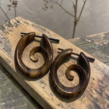 Load image into Gallery viewer, boho spiral wood earrings with stick post on rustic wood board tribal artisan wooden jewelry