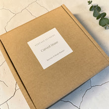 Load image into Gallery viewer, Vintage Alchemy carved stone incense and resin burner packaging box on mineral stone surface with eucalyptus branch