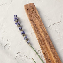 Load image into Gallery viewer, carved wooden incense burner with lavender on neutral limewashed plaster background