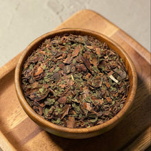 Load image into Gallery viewer, loose leaf chocolate cacao peppermint tea blend in wooden bowl on wood tray