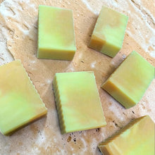 Load image into Gallery viewer, Citrus Bloom cold process soap bars on warm beige limestone botanical handmade soap