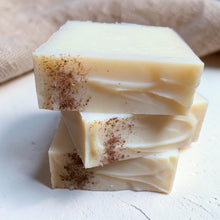 Load image into Gallery viewer, Stack of three Dune cold process soap bars with creamy ivory tones, cocoa-dusted accents, and textured tops on a soft plaster surface with natural linen background.
