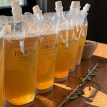 Load image into Gallery viewer, Herb & Air natural liquid castile soap refill pouches in studio light on wood surface
