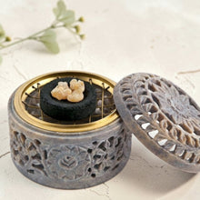 Load image into Gallery viewer, lotus carved stone incense burner with charcoal disk and resin incense on neutral plaster background