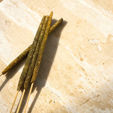 Load image into Gallery viewer, Nag Champa herb and resin incense sticks on pale natural stone surface