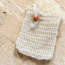 Load image into Gallery viewer, Natural sisal soap saver bag made from agave fiber on stone surface