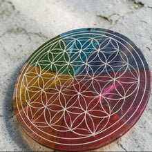 Load image into Gallery viewer, Colorful geometric coaster with a flower of life pattern on a concrete surface