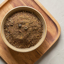 Load image into Gallery viewer, Loose leaf sea buckthorn herbal tea blend in ceramic bowl on wooden tray