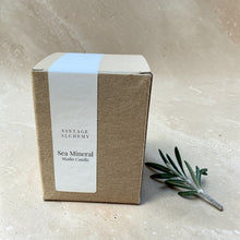 Load image into Gallery viewer, Sea Mineral studio candle in kraft box with vertical wrap label, coconut apricot wax candle with ozone eucalyptus moss scent profile