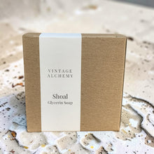 Load image into Gallery viewer, Minimal kraft box packaging for Shoal glycerin soap with a white wrap label displayed on a textured coastal-inspired surface.