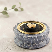 Load image into Gallery viewer, Stone incense and resin burner with charcoal disc and resin on mineral stone surface with eucalyptus branch