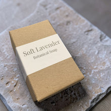 Load image into Gallery viewer, Soft Lavender botanical soap in kraft box packaging on natural stone surface handcrafted soap by Vintage Alchemy