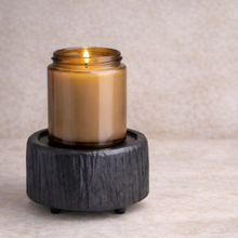 Load image into Gallery viewer, Charred Timber 2-in-1 wax warmer warming a 9oz amber glass candle on textured stone surface
