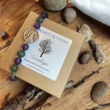 Load image into Gallery viewer, Amethyst and Moss agate stretch bracelet sitting on gift box
