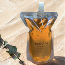 Load image into Gallery viewer, Herb &amp; Air product packaging on a stone surface with a eucalyptus leaf.
