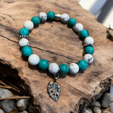 Load image into Gallery viewer, Turquoise stretch bra bracelet with howlite beads and leaf
