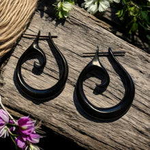 Load image into Gallery viewer, Black hoop earrings on a wooden surface with flowers

