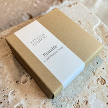 Load image into Gallery viewer, Vintage Alchemy Bramble cold process soap in kraft box with minimal white label on natural limestone surface
