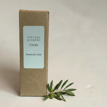 Load image into Gallery viewer, Vintage Alchemy Citrine Botanical Lotion in minimalist kraft box on soft neutral plaster background
