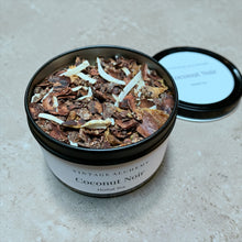 Load image into Gallery viewer, Coconut Noir herbal tea in a black and white container on a beige surface
