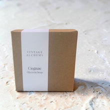 Load image into Gallery viewer, Cognac glycerin soap in kraft box packaging with Vintage Alchemy label on a light stone surface
