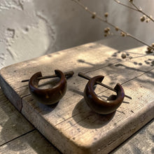 Load image into Gallery viewer, dark wood hoop earrings with stick post on rustic wood board boho artisan wooden jewelry
