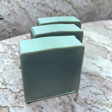 Load image into Gallery viewer, Vintage Alchemy Earl Grey cold process soap bars with soft sage green color arranged on natural stone surface
