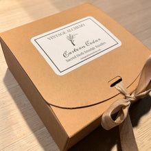 Load image into Gallery viewer, Eastern cedar sacred herb smudge bundle gift box tied with ribbon by Vintage Alchemy
