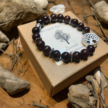 Load image into Gallery viewer, garnet beaded bracelet sitting on kraft box
