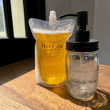 Load image into Gallery viewer, Refillable glass soap dispenser with Herb and Air liquid soap refill pouch
