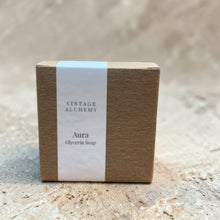 Load image into Gallery viewer, boxed shea butter glycerin soap aura soft floral musk in kraft packaging with minimal label on neutral limestone surface
