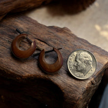Load image into Gallery viewer, Wooden earrings on a wooden block with a coin for scale
