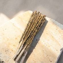 Load image into Gallery viewer, Palo Santo Vanilla herb and resin incense sticks on pale natural stone surface
