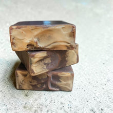Load image into Gallery viewer, Stacked bars of Pyre handmade soap with deep brown and earthy tan swirls, scented with Dragon’s Blood.
