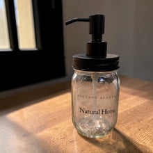 Load image into Gallery viewer, Refillable glass soap dispenser with black pump on wooden surface
