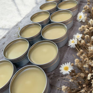 rows of cuticle cream in tins