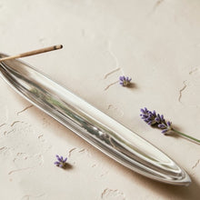 Load image into Gallery viewer, silver metal incense burner with incense stick on neutral limewashed plaster background
