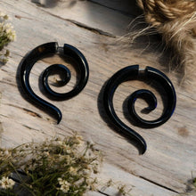 Load image into Gallery viewer, Spiral faux gauge earrings in salvaged horn front view
