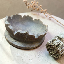 Load image into Gallery viewer, Stone lotus smudge bowl incense holder on neutral mineral surface with sage bundle and soft botanical background
