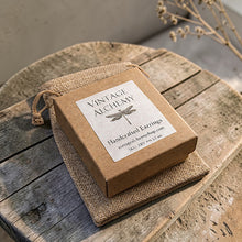 Load image into Gallery viewer, Vintage Alchemy wood earrings packaging in kraft jewelry box with burlap pouch on rustic wood surface
