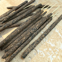 Load image into Gallery viewer, Warm Sandal herb and resin incense sticks with sandalwood botanicals on natural stone surface
