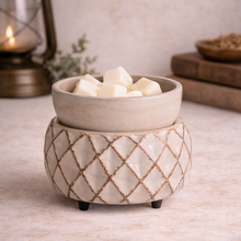 Load image into Gallery viewer, 2-in-1 wax warmer in ivory lattice ceramic finish with white wax melts on neutral botanical studio background
