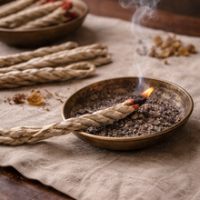 Load image into Gallery viewer, Botanical rope incense burning in a brass dish with soft smoke rising
